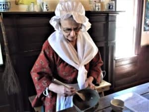 Colonial woman making mustard